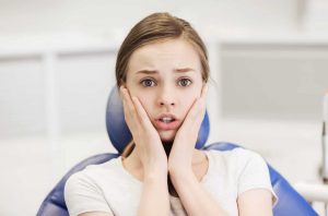 lady suffering with dental anxiety